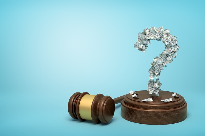 Banknote Question Mark and Gavel Against Blue Background