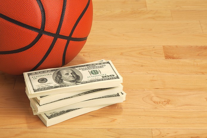 Basketball with Stack of 100 Dollar Bills