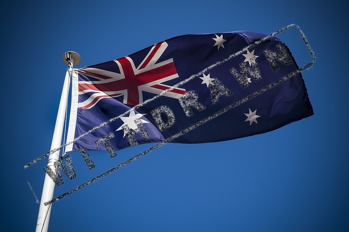 Black Withdrawn Stamp on Australian Flag Against Blue Sky