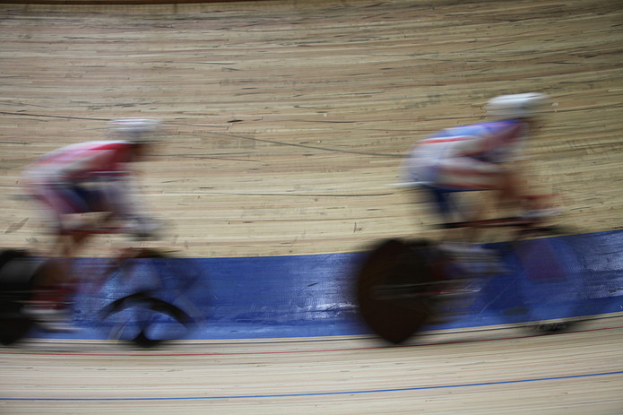 Blurred Cyclists in Velodrome