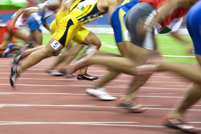 Blurred Sprinters on Track