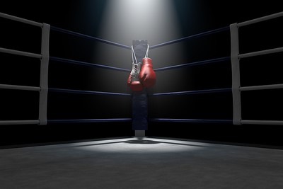 Boxing Gloves in Corner Under Spotlight