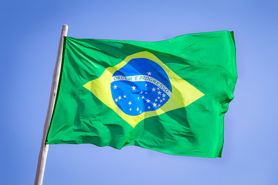 Brazil Flag Against Blue Sky