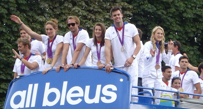 Camille Muffat and French Olympic Team Parading Medals