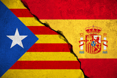 Catalan and Spanish Flags on Broken Wall
