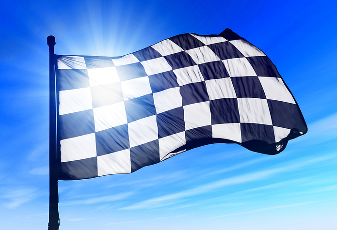 Checkered Flag Against Blue Sky