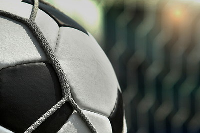 Close Up of Football Against Net