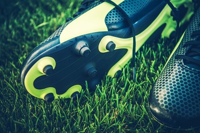 Close Up of Football Boot Studs on Grass