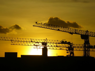 Cranes at Sunset on Construction Site
