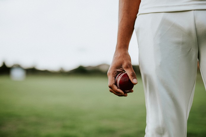 Cricket Player Holding Ball