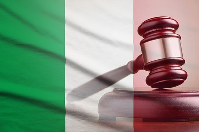 Double Exposure of Italian Flag and Wooden Gavel