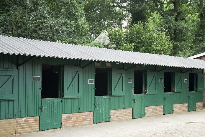 Empty Row of Green Stables