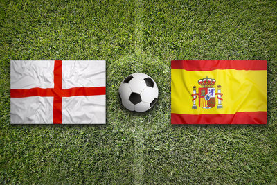 England and Spain Flags on a Football Pitch
