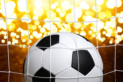 Football Against Golden Lights