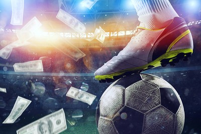 Football Boot on Ball with Falling Money