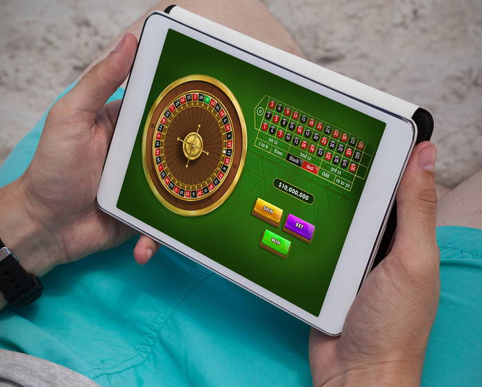 Man Playing Roulette On Tablet