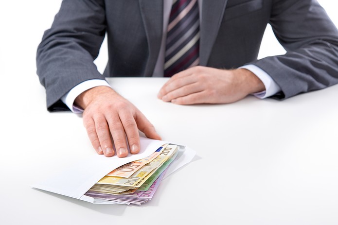 Man in Suit with Envelope Full of Euros