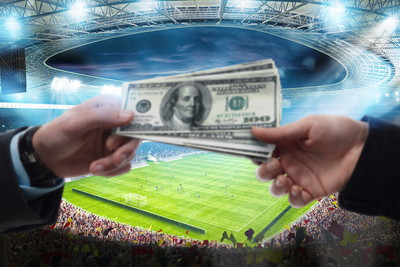 Money Exchanged Against Football Stadium