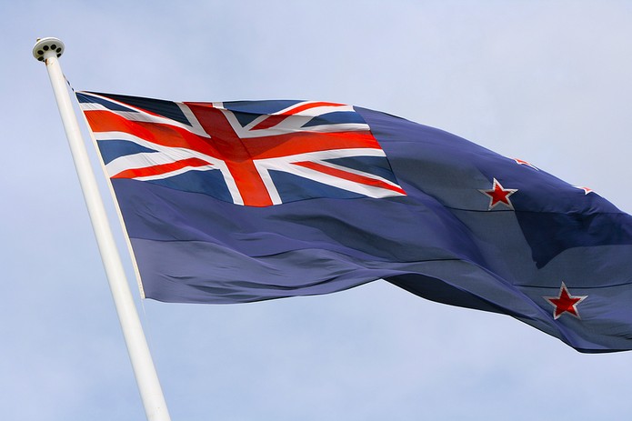 New Zealand Flag Against Light Cloudy Sky