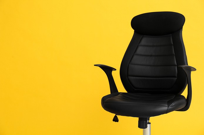 Office Chair Against Yellow Background