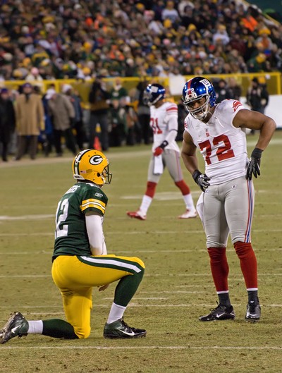 Osi Umenyiora with Aaron Rodgers