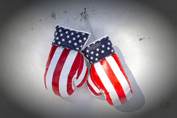 Pair of USA Flag Boxing Gloves Hanging on Wall