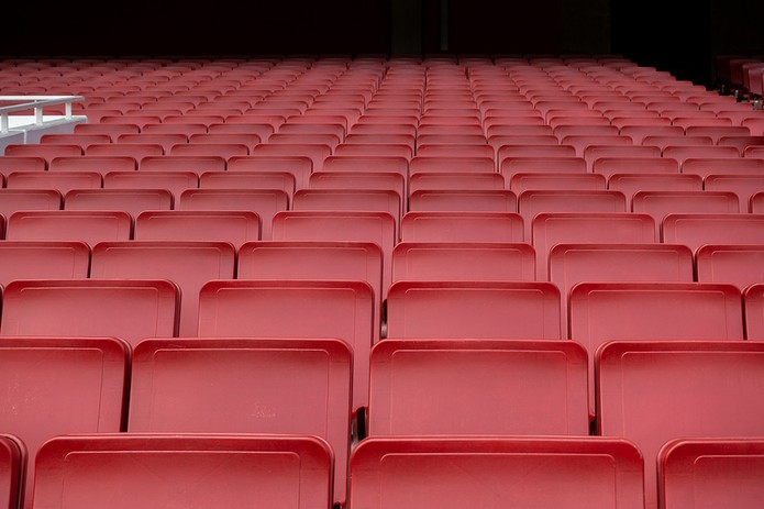 Red Folding Seats in Empty Stadium