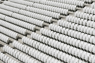 Rows of White Seats in Empty Stadium