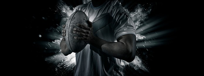 Rugby Player Holding Ball