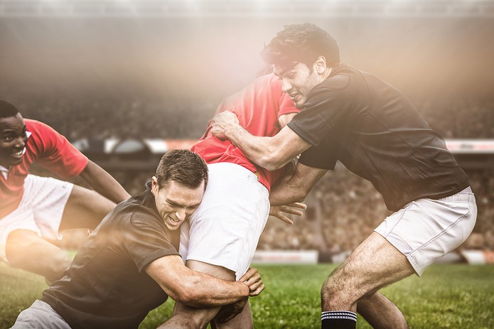 Pemain Rugby Membuat Tackle dalam Game