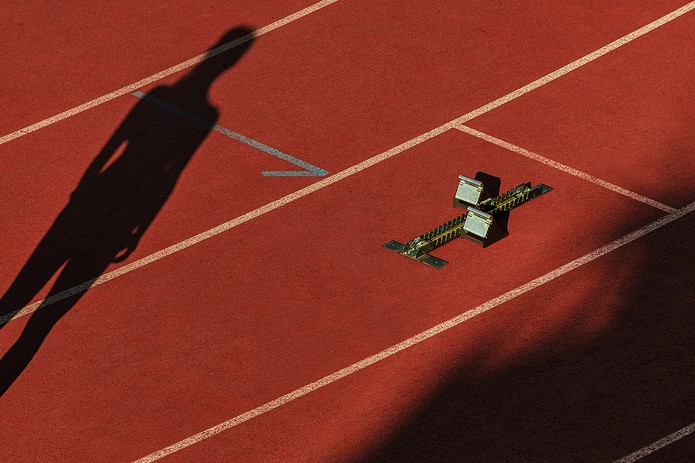 Silhouette of Female Athlete on Running Track