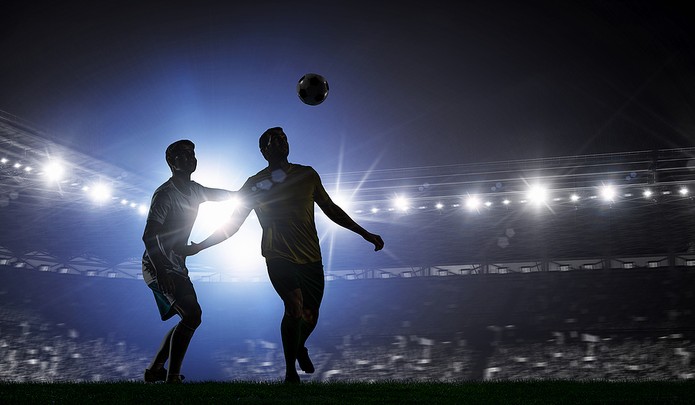 Silhouette of Footballer Heading Ball