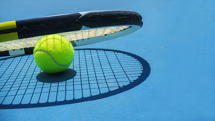 Tennis Racket on Blue Court