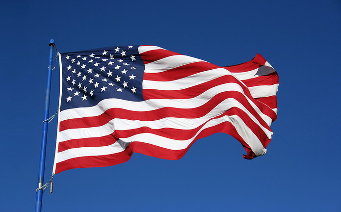USA Flag Against Clear Blue Sky
