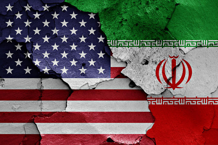 USA and Iran Flags on a Cracked Wall