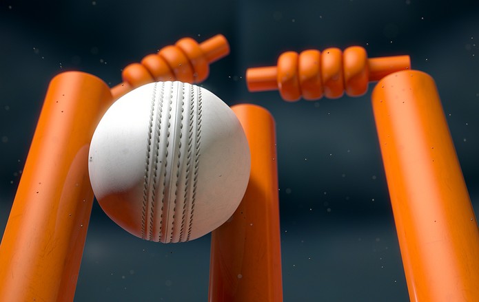 White Cricket Ball Hitting Orange Wickets