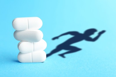 White Pills with Silhouette of Sportsperson