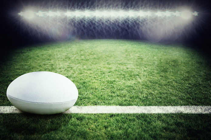 White Rugby Ball on Pitch