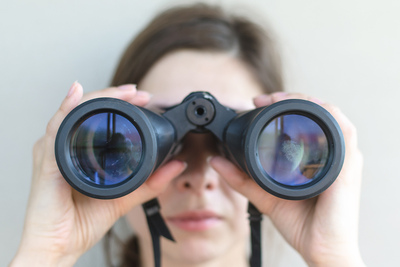Woman Looking Through Binoculars