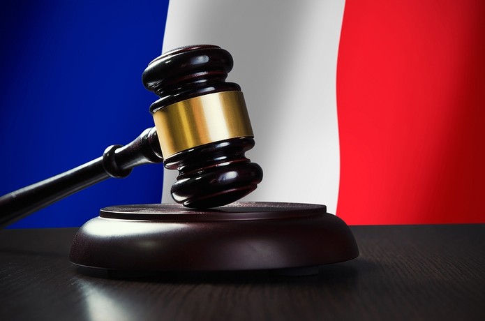 Wooden Gavel Against French Flag