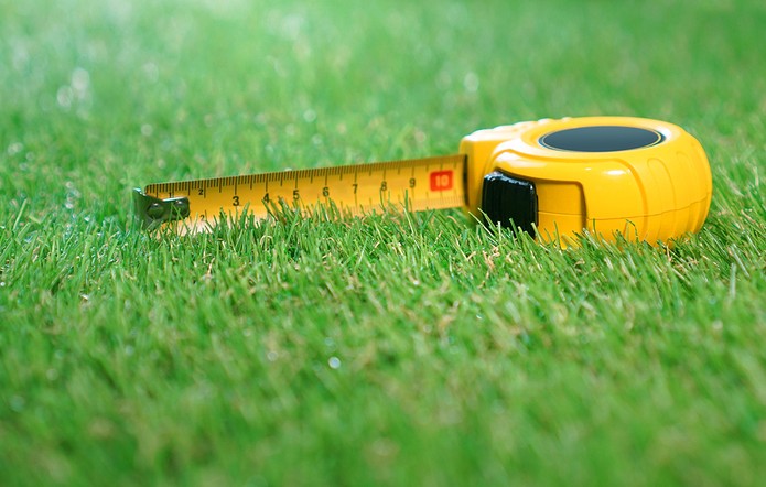 Yellow Tape Measure on Grass